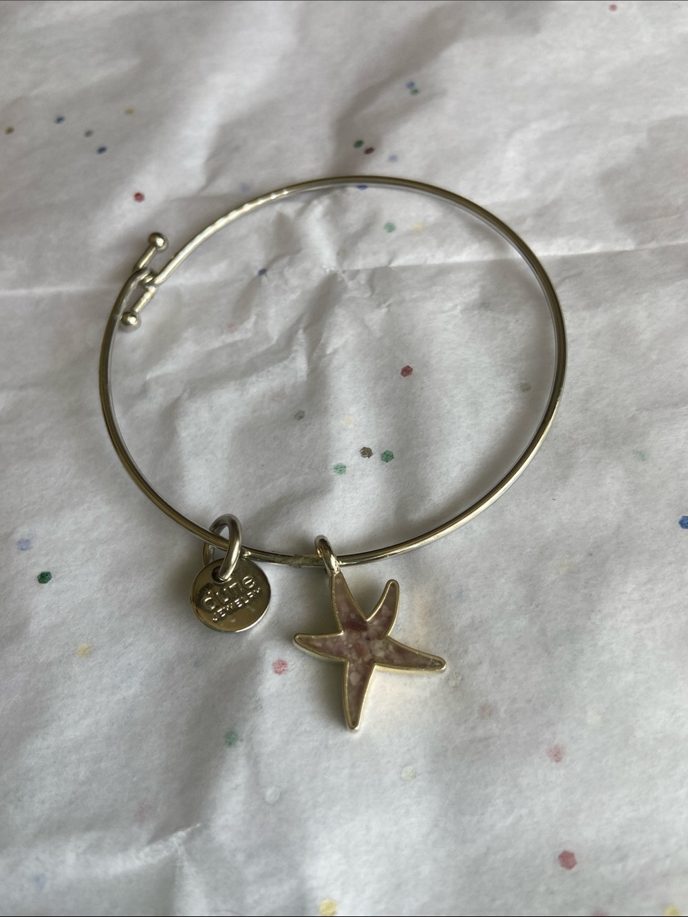 Dune Silvertone Starfish bangle with charm that says handmade in USA